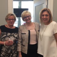 <p>Donna Riniti of Coldwell Banker, center, celebrates with sales associates at the White Plains office. </p>