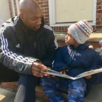 <p>Carlyle Myrie of Hackensack and his son, Ethan, 4. Myrie is a soccer coach in Clifton and began teaching spin at local gyms after he was let go from Teaneck schools.</p>