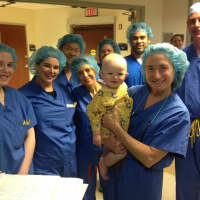 <p>Dr. Carol Shields and her team show baby Liam some love right before one of his exams.</p>