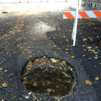 <p>Holes in the road like this one closed Route 22 at Franklin Turnpike in Mahwah today.</p>