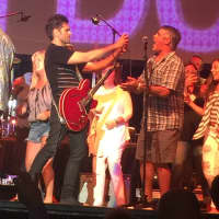 <p>John Stamos on stage with The Beach Boys.</p>