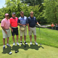 <p>Paul Kuehner, Joe Fossi, Reed Whipple and Nick Wood prepare to tee off at the SilverSource golf outing Monday.</p>