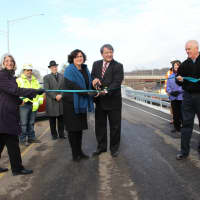 <p>County Executive George Latimer, Legislator MaryJane Shimsky and other public officials during a ribbon-cutting ceremony at the Ashford Avenue Bridge, as another phase of work is completed ahead of schedule.</p>