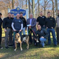 <p>RBARI board president Steven Goldstein accepts a $3,000 check from the Paramus PBA, accompanied by Training for Warriors coaches.</p>