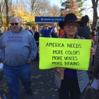 <p>&quot;America needs more colors, more choices, more brains&quot; says a marcher&#x27;s sign.</p>