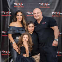 <p>The Ismail family celebrates the opening of Pizza One in Sparta.</p>