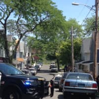 <p>Police close off Kossuth Street in Norwalk on Sunday to investigate a shooting.</p>