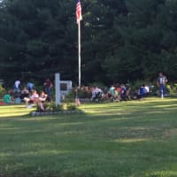 <p>Pokemon Go players gather at the World War II Rose Arbor in Rogers Park in Danbury.</p>