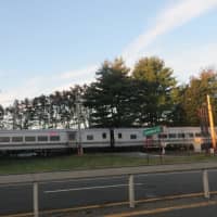 <p>A northbound Metro-North commuter train as it passes through Commerce Street in Valhalla on Monday.</p>