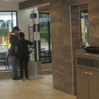 <p>Big brother? A McDonald&#x27;s employee assists a customer at the new automated kiosks in Thornwood -- aimed at speeding service. It took 12 steps to order one meal Monday, and even the worker confided &quot;it&#x27;s not customer-friendly.&quot;</p>