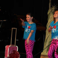 <p>Chloe Adams, left, and Stella Bartolotta, right, danced to the song &quot;Welcome to New York,&quot; with props.</p>