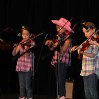 <p>&quot;The Violettas&quot; played a country song on the violin. Pictured left to right are Chloe Leimgruber, Apara Chandavarkar, Madison Parker and Lily Farmer.</p>