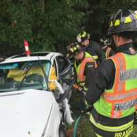 <p>Westport firefighters freed one person trapped in a car after a three-car crash on the Sherwood Island Connector Friday morning.</p>