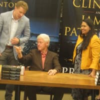 <p>Bill Clinton of Chappaqua signing copies of his new novel, &quot;The President Is Missing,&quot; at a Barnes &amp; Noble store in Scarsdale on Tuesday night.</p>