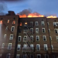 <p>The fire broke out in the upper floors of the apartment complex at 1 Hawley Terrace, off Warburton Avenue, and spread through the roof.</p>