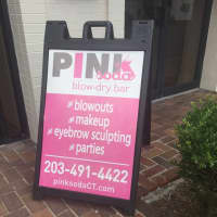 <p>A sign for the new Pink Soda Blow Dry Bar in Ridgefield.</p>