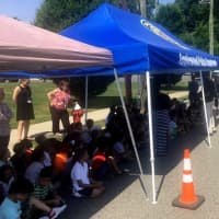 <p>Tents protected the children from the scorching sun during a demonstration by the Englewood Police Motorcycle Unit.</p>