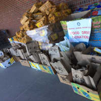 <p>Members of Westport Sunrise Rotary collect over 50 boxes of food on Saturday at Stop &amp; Shop for a food drive to benefit Homes With Hope. It was enough to fill five SUVs and a van.</p>