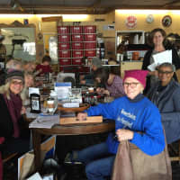 <p>Soli Pierce, far left, with fellow postcard writing attendees at The Black Cow Coffee Company in Croton. The impending Tuesday snowstorm has forced organizers to regroup this week. It still will be at the cafe Monday, Wednesday and Thursday.</p>