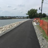 <p>City officials celebrated the re-opening of the walking path at Kosciuszko Park Monday afternoon.</p>