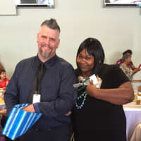 <p>Staff at a special senior prom luncheon in Stamford hand out prizes to attendees Wednesday.</p>