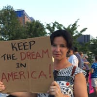 <p>Robie Spector of Westport said she came to the rally because her parents were refugees. She believes more immigrants should have the same opportunities in the U.S. as her parents.</p>