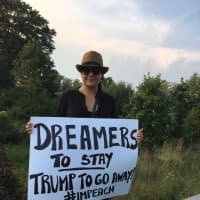 <p>One of the signs in the crowd at the DACA rally in Stamford says, &#x27;Dreamers To Stay, Trump To Go Away. #Impeach.&#x27;</p>
