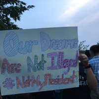 <p>One sign at the Stamford rally says, &#x27;Our Dreams Are Not Illegal. #NotMyPresident.&#x27;</p>