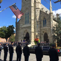 <p>Police officers line up on Main Street outside St. Peter&#x27;s Church for the funeral Mass for Danbury Police Sgt. Drew Carlson.</p>
