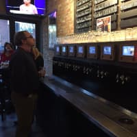 <p>Contemplating the pour options at the Self Pour Taproom at Frankie &amp; Fanucci’s Wood Oven Pizzeria in Mamaroneck.</p>