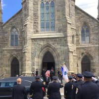 <p>The flag-draped coffin of Danbury Police Sgt. Drew Carlson leaves St. Peter&#x27;s Church after his Funeral Mass on Friday.</p>