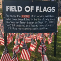 <p>The sign on the sea of flags at WestConn has been updated with the current death toll of service members killed in the war on terror: 7,008.</p>