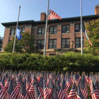 <p>A sea of flags are planted in the lawn of the midtown campus of Western Connecticut State University in Danbury.</p>