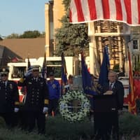 <p>Danbury Mayor Mark Boughton stands at attention at the 9/11 Remembrance Ceremony on Monday evening.</p>