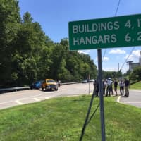 <p>News crews on the scene of an accident Monday that closed Airport Road near the Westchester County Airport following a police chase from Greenwich, Conn.</p>