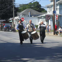 <p>A pipe band marches in the Peekskill July 4 parade.</p>