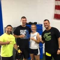 <p>One Fitness owners Angelo Mazza (far left) and Rob DeBrino (far right) with the happy couple</p>