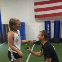 <p>Norwood Police Officer John Kuder proposed to his girlfriend, Brianne Deptuch, during their morning work out.</p>