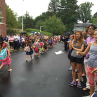 <p>Parents cheer and take photos to capture the first day of school at Darien&#x27;s Royle School.</p>