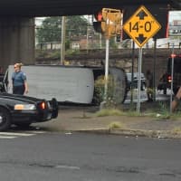 <p>Police have blocked the road at the scene of a van rollover accident near downtown Stamford.</p>