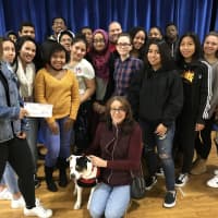 <p>Hackensack High School journalism students from all grades raised more than $800 for Pawsitively Forever. Seated is Laura Witzal with rescue pup Allie.</p>