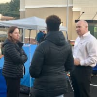 <p>Franchise owner Archer Bullock greets the early arrivals in the campout at the new Chick-Fil-A in Norwalk.</p>