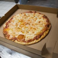 <p>The finished product: A record-setting 109 cheese pizza.</p>