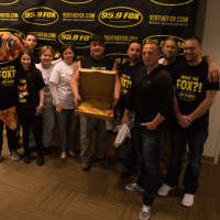 <p>The crew from 95.9 The Fox with the 109 cheese pizza.  L to R: Stephanie Webster, Matt Nuzzo, Todd and Monica Brown, Dennis Letizia and Erik Ofgang.</p>