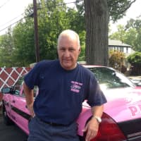 <p>John LaFalce, a Ridgefield volunteer firefighter and Pink Heals Bergen County president, with the organization&#x27;s 2006 Ford patrol car.</p>