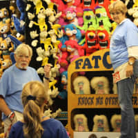 <p>Roy Kulscar and Gina Duffy volunteer at the Fat Cat game. </p>