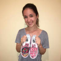 <p>New Rochelle teen Rebecca Feldman with one of her sneaker designs.</p>