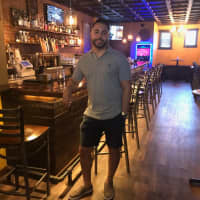 <p>Albert Tirado, 32 of Old Tappan, stands in Barrel &amp; Brew on River Road in New Milford, formerly Brookchester Beer and Liquor.</p>