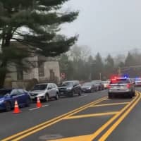 <p>Cars backed up for nearly a mile waiting in line at the first government-run drive-thru coronavirus testing site at Bergen County Community College Friday.</p>