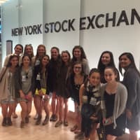 <p>Christine Capizzi with her students at the NYSE.</p>